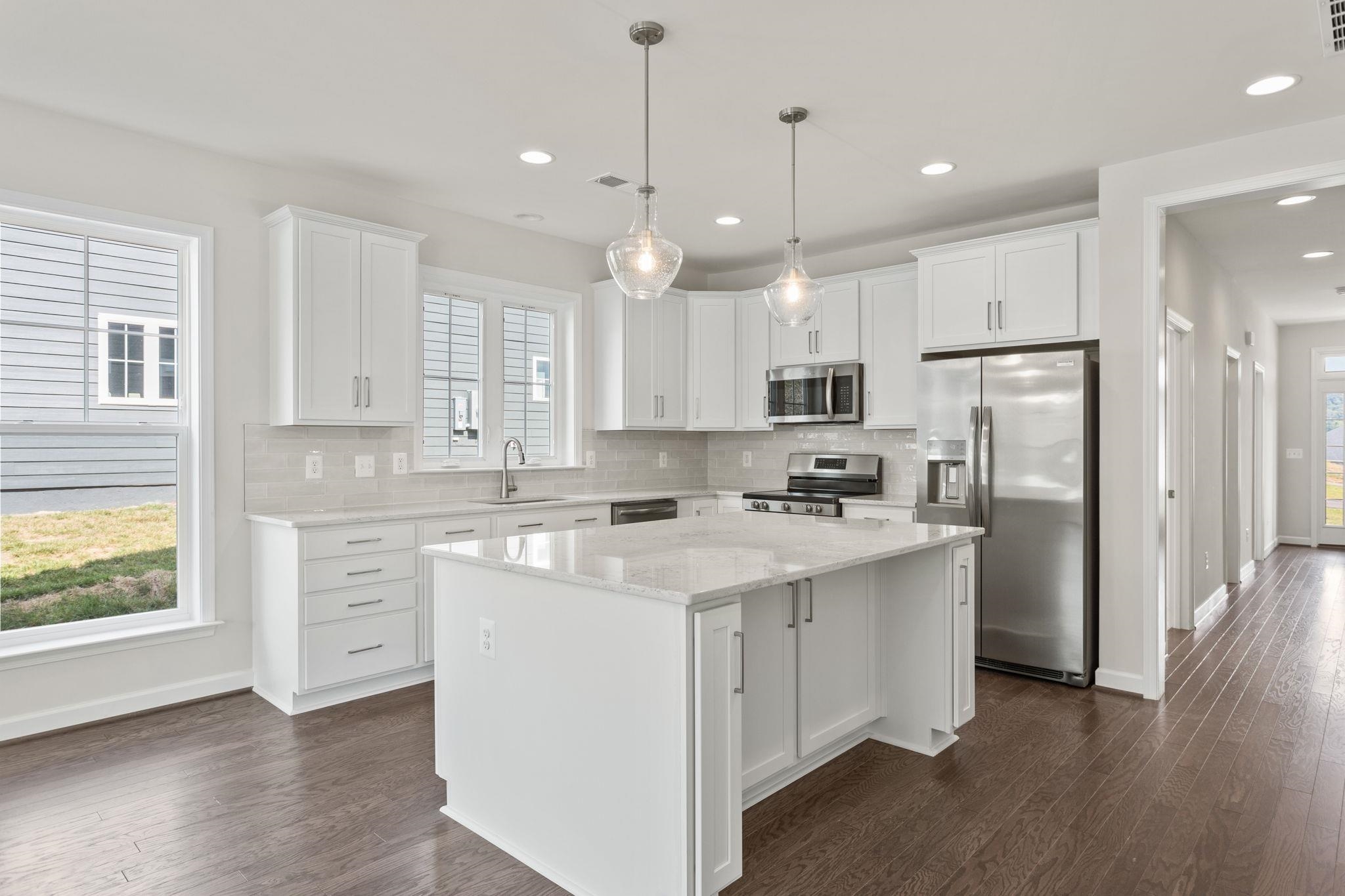 2766 Rutlege Road, Unit 191 Harrisonburg, VA 22801 - Photo 5 of 29 a kitchen with kitchen island a sink stainless steel appliances and cabinets