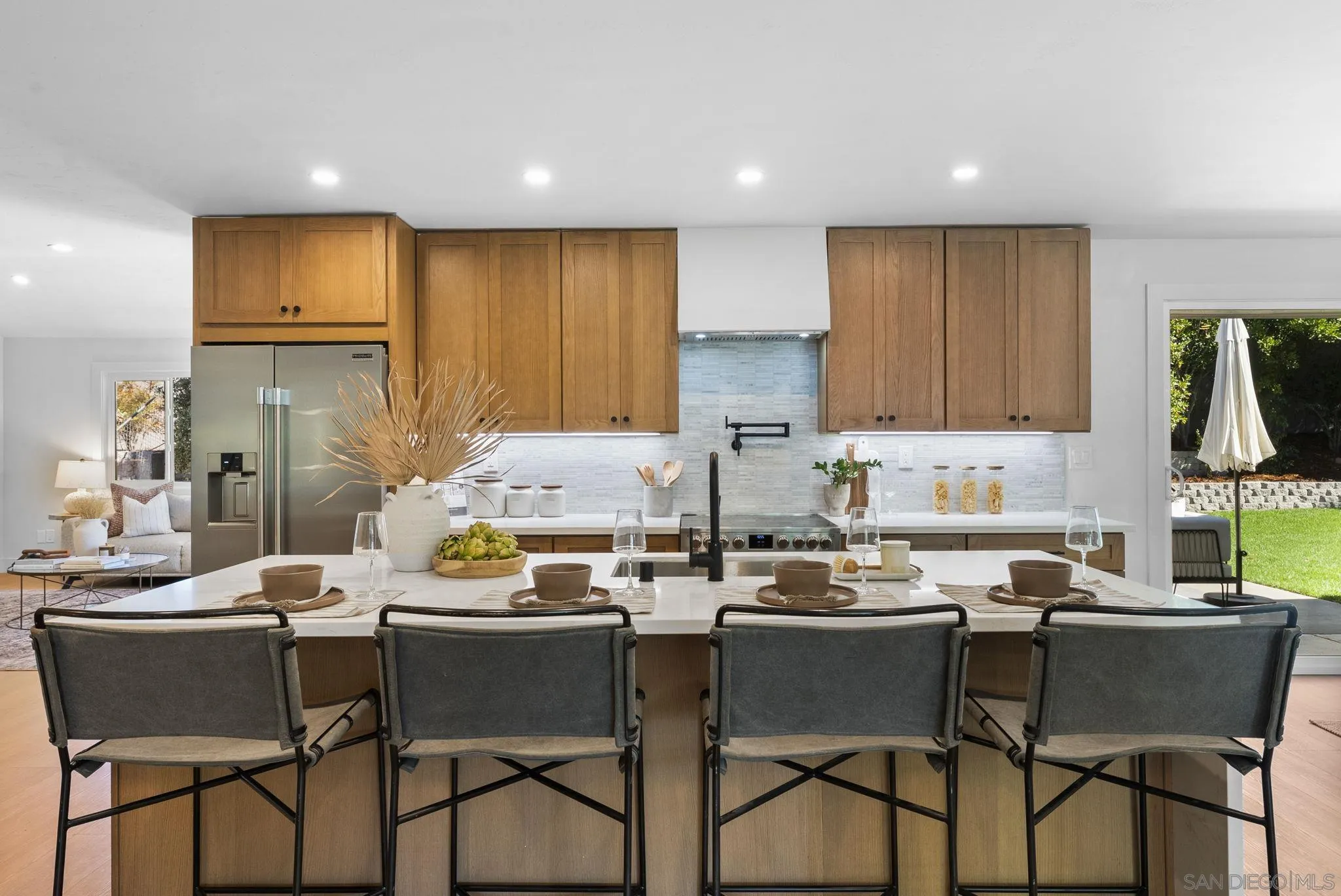 12830 Avenida La Valencia Poway, CA 92064 - Photo 11 of 47 a dining room with furniture and a kitchen view