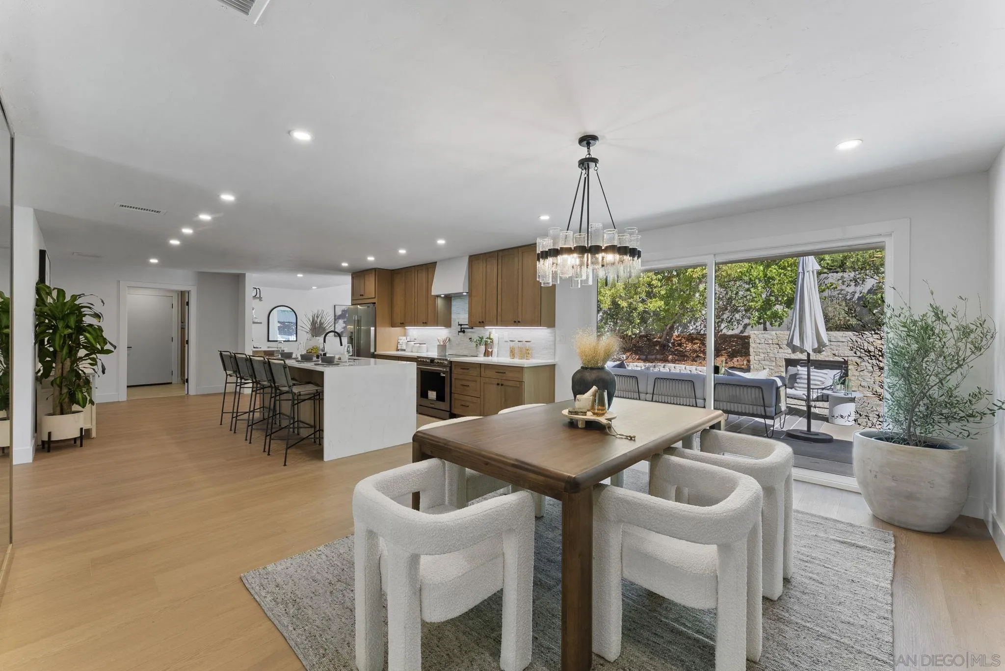 12830 Avenida La Valencia Poway, CA 92064 - Photo 14 of 47 a kitchen with a table and chairs in it