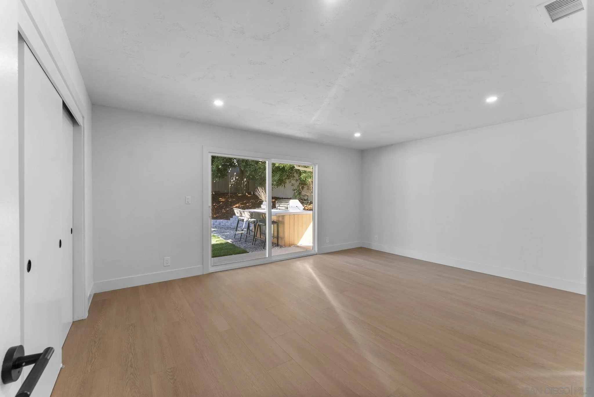 12830 Avenida La Valencia Poway, CA 92064 - Photo 28 of 47 a view of a livingroom with wooden floor and a large window