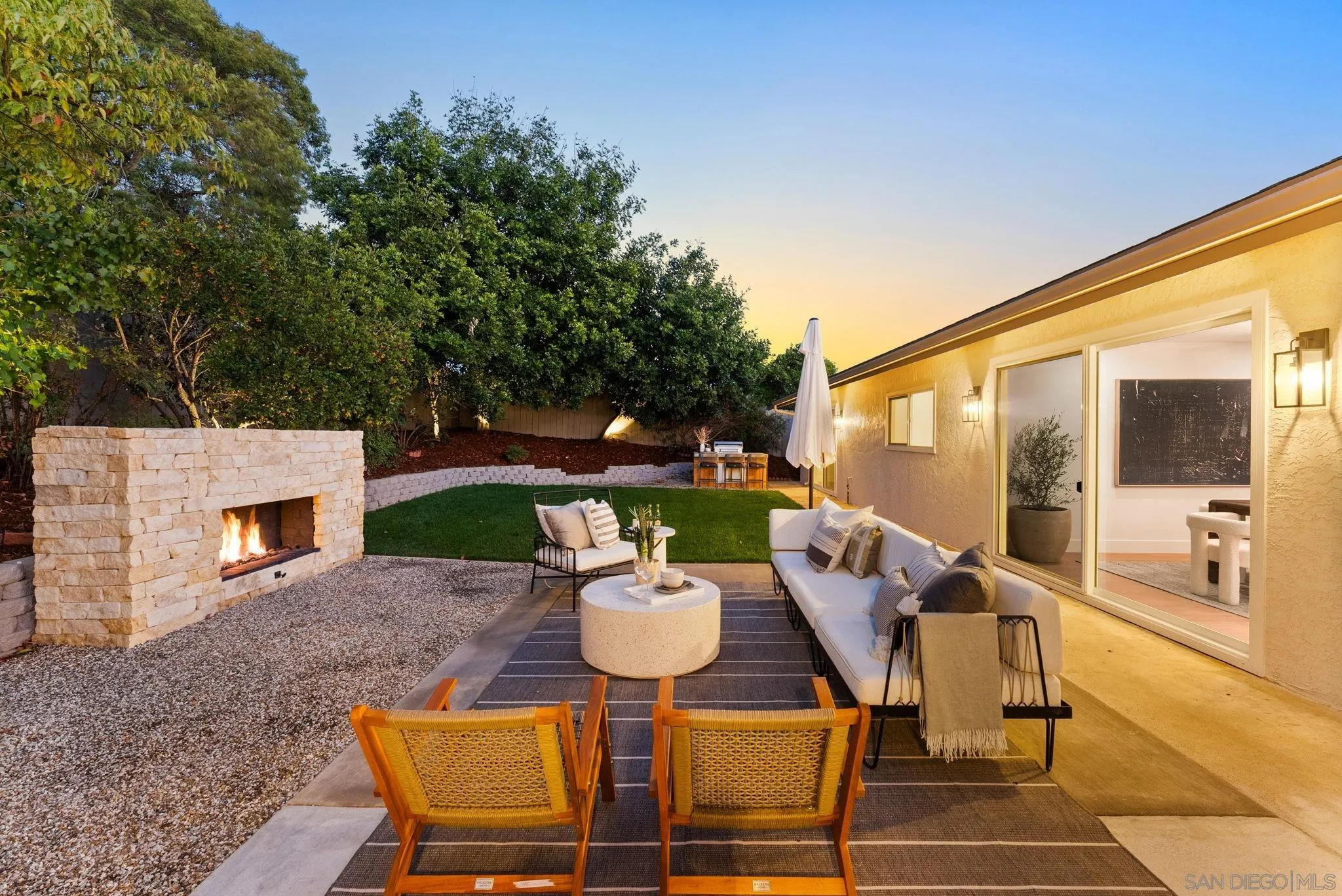 12830 Avenida La Valencia Poway, CA 92064 - Photo 34 of 47 a view of a patio with a dining table and chairs with two couches