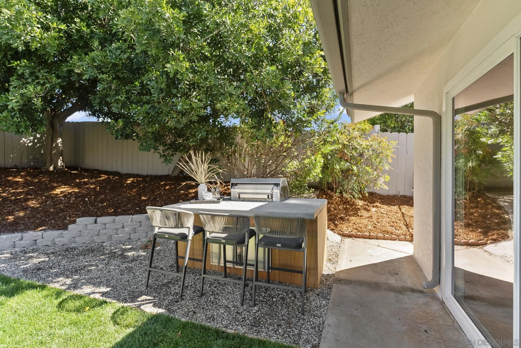 12830 Avenida La Valencia Poway, CA 92064 - Photo 35 of 47 a view of a patio with table and chairs and potted plants