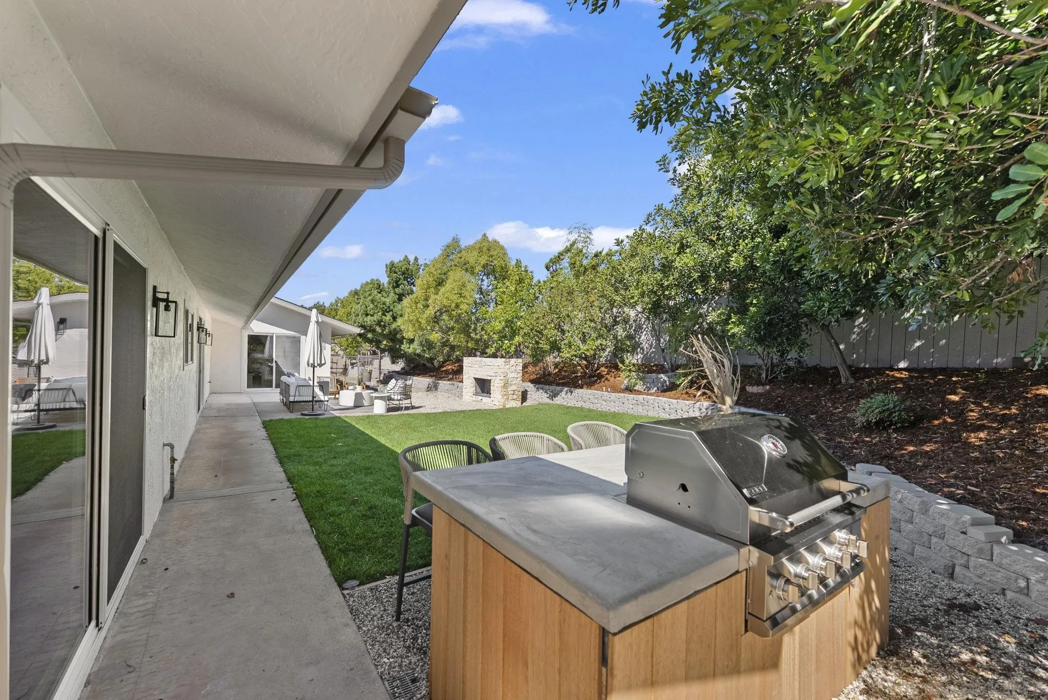 12830 Avenida La Valencia Poway, CA 92064 - Photo 36 of 47 a backyard of a house with table and chairs