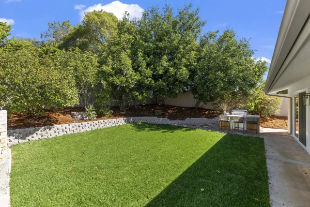 a view of outdoor space with deck and yard
