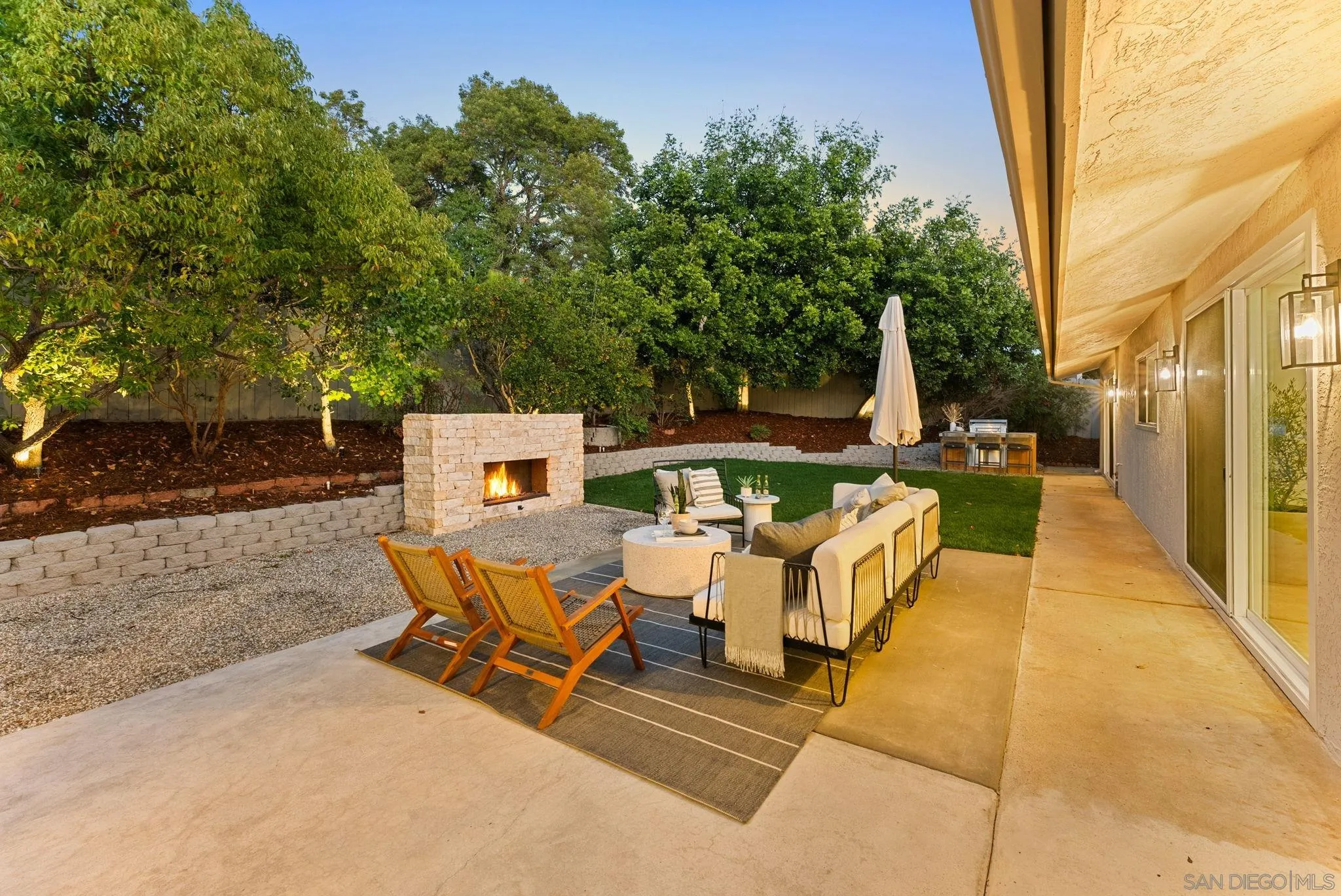 12830 Avenida La Valencia Poway, CA 92064 - Photo 40 of 47 a view of a patio with table and chairs and potted plants