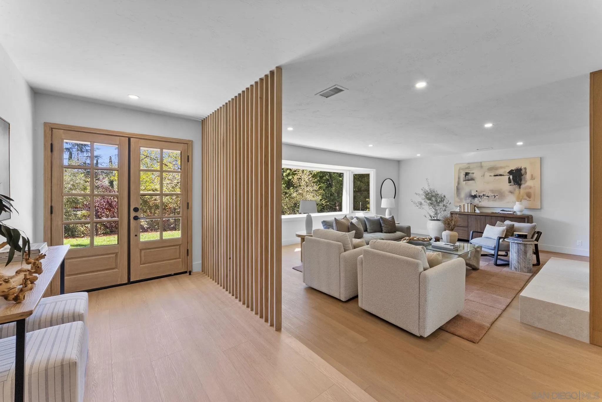 12830 Avenida La Valencia Poway, CA 92064 - Photo 4 of 47 a living room with furniture and large windows