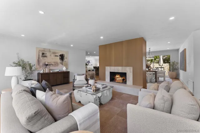 a living room with furniture fireplace and a fireplace