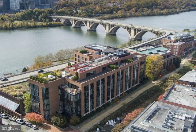 a view of a house with outdoor space and a lake view