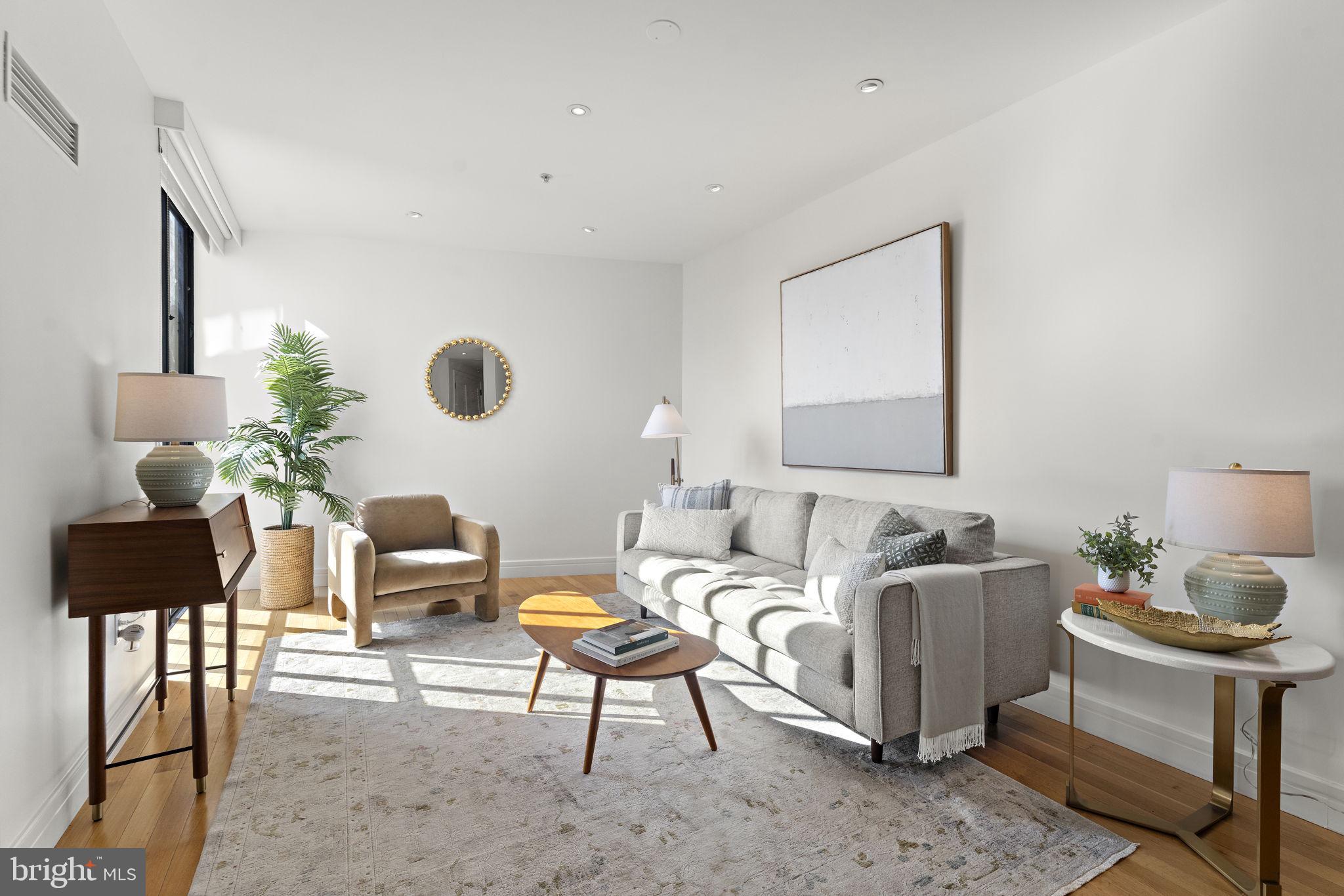 3303 Water Street Northwest, Unit 4L Washington, DC 20007 - Photo 13 of 60 a living room with furniture wooden floor and a lamp