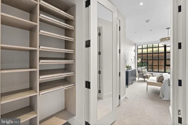 a view of a livingroom with furniture and white walls