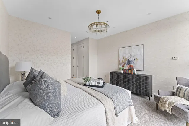 a bedroom with a bed and ceiling fan