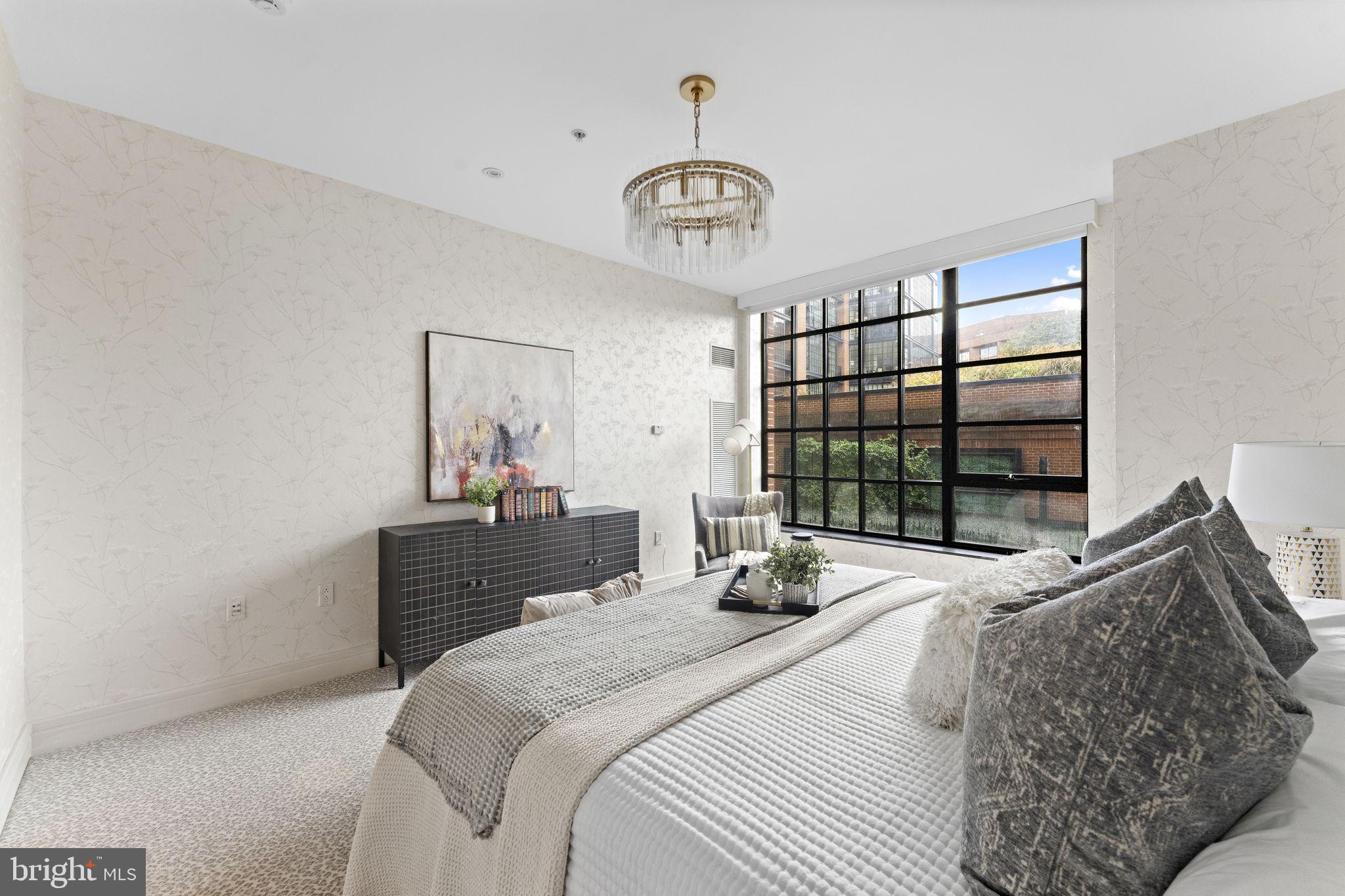 3303 Water Street Northwest, Unit 4L Washington, DC 20007 - Photo 19 of 60 a bedroom with a bed and a window