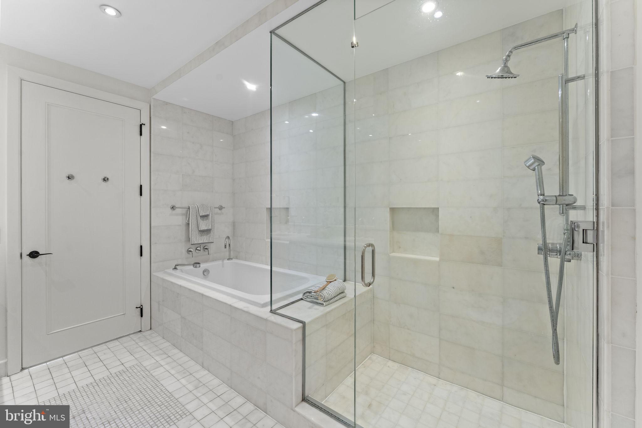 3303 Water Street Northwest, Unit 4L Washington, DC 20007 - Photo 23 of 60 a bathroom with a bathtub and a shower