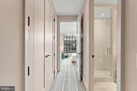 a view of a bathroom from a hallway