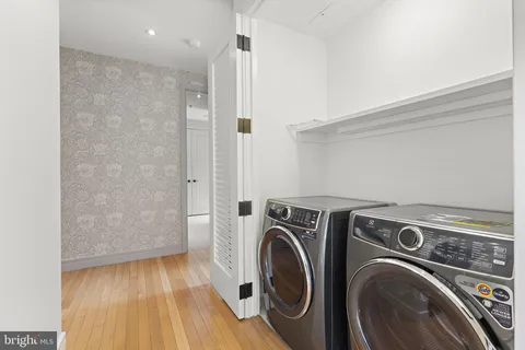 a view of storage and utility room with washer and dryer