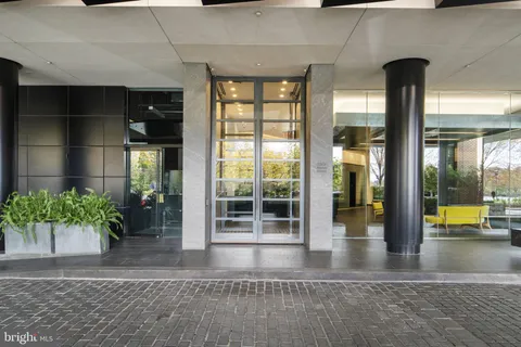 a view of lobby with a potted plant and floor to ceiling window