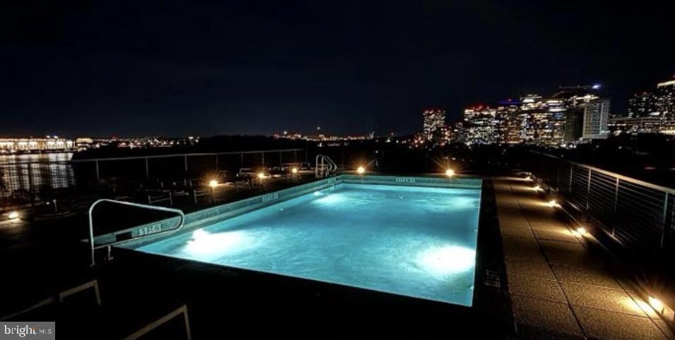 3303 Water Street Northwest, Unit 4L Washington, DC 20007 - Photo 41 of 60 a view of swimming pool from a balcony