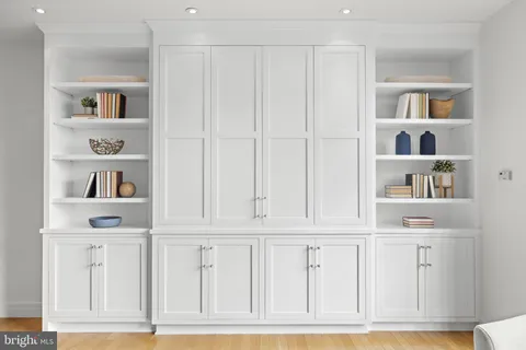 a view of kitchen with white cabinets and cabinet