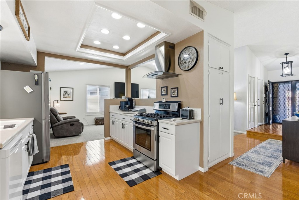 3809 Kern Road Chino, CA 91710 - Photo 11 of 43 a kitchen with stainless steel appliances granite countertop a refrigerator a stove and a sink