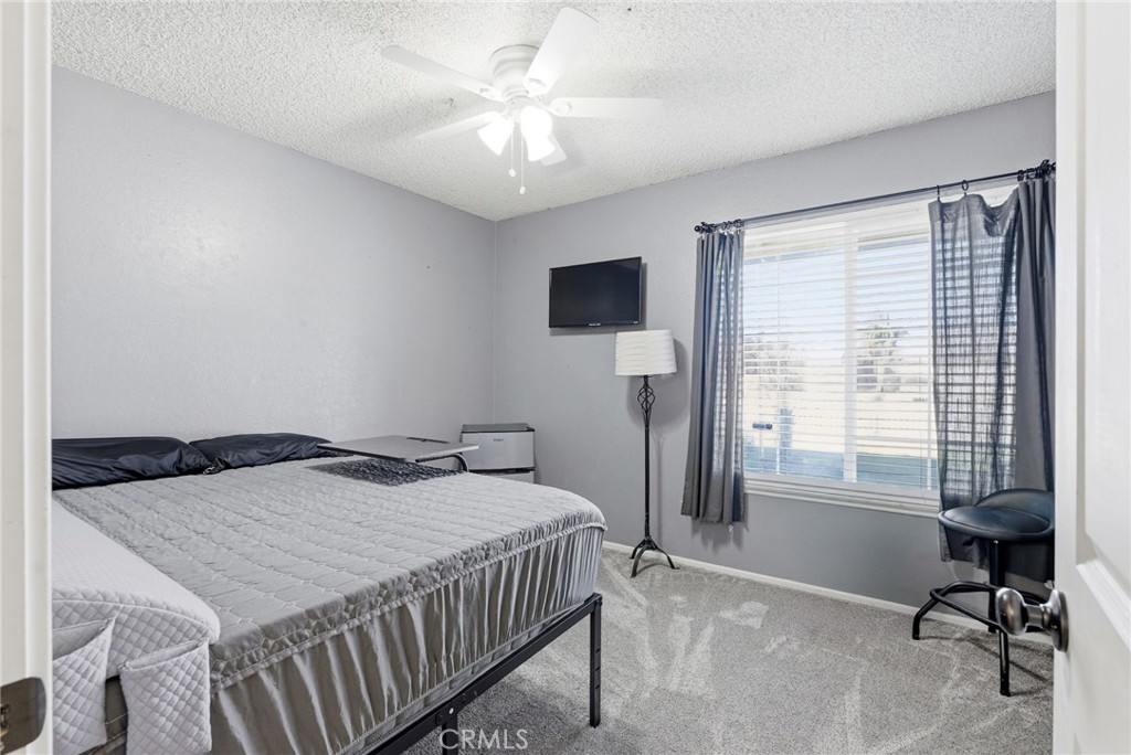 3809 Kern Road Chino, CA 91710 - Photo 21 of 43 a bedroom with a bed and a table in it