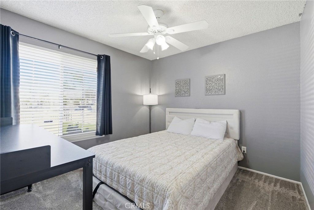 3809 Kern Road Chino, CA 91710 - Photo 22 of 43 a bedroom with a large bed and a chandelier