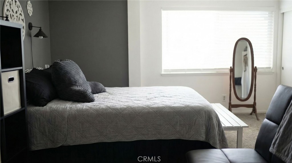 3809 Kern Road Chino, CA 91710 - Photo 24 of 43 a bedroom with a bed and a mirror