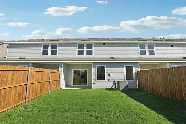 a view of a house with backyard