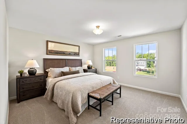 a bedroom with double bed and window