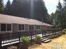 5706 Ridgewood Road Willits, CA 95490 - Photo 1 of 1 a front view of a house with a yard
