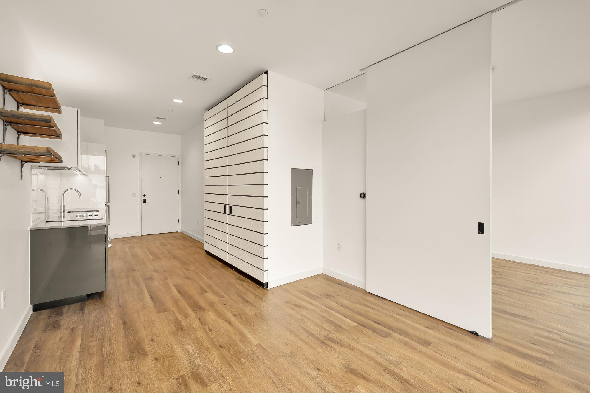 57 N Street Northwest, Unit 331 Washington, DC 20001 - Photo 12 of 26 a view of a kitchen with a sink and dishwasher wooden floor