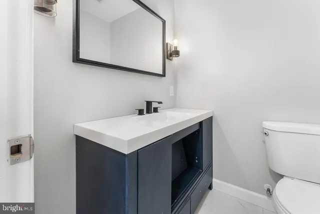 a bathroom with a sink and a toilet