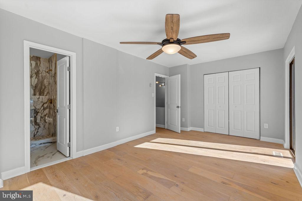 5034 Nash Street Northeast Washington, DC 20019 - Photo 14 of 36 a view of an empty room with wooden floor