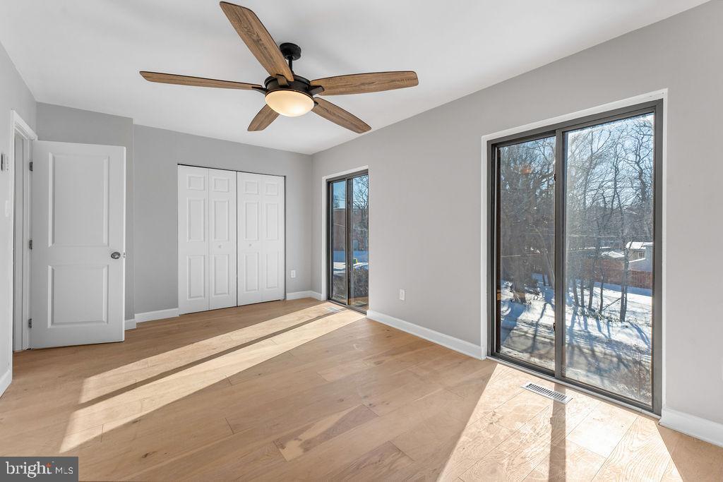 5034 Nash Street Northeast Washington, DC 20019 - Photo 20 of 36 a view of a livingroom with a ceiling fan and window in a room