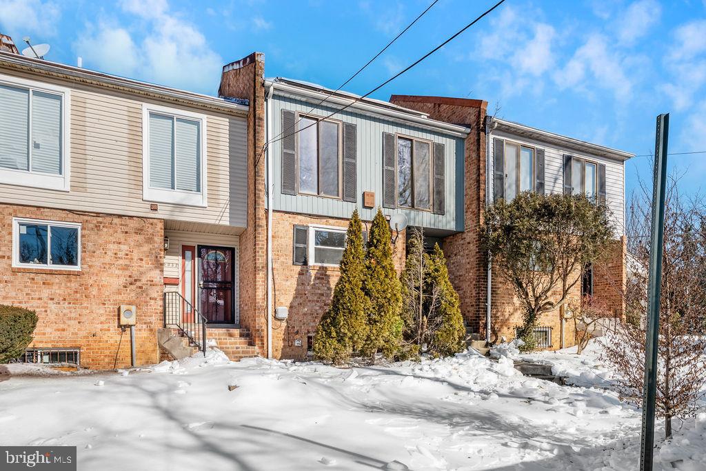 5034 Nash Street Northeast Washington, DC 20019 - Photo 2 of 36 a front view of a house with a yard