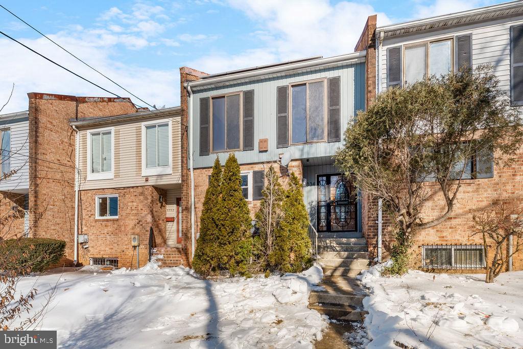 5034 Nash Street Northeast Washington, DC 20019 - Photo 3 of 36 a view of a brick house with a large windows