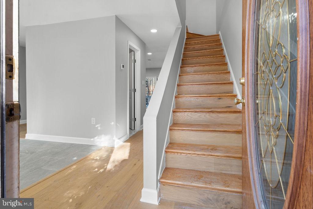 5034 Nash Street Northeast Washington, DC 20019 - Photo 4 of 36 a view of staircase with white walls and windows