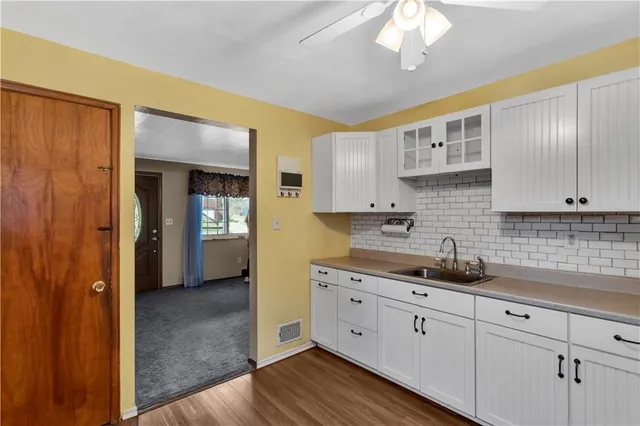 a kitchen with cabinets a sink and dishwasher