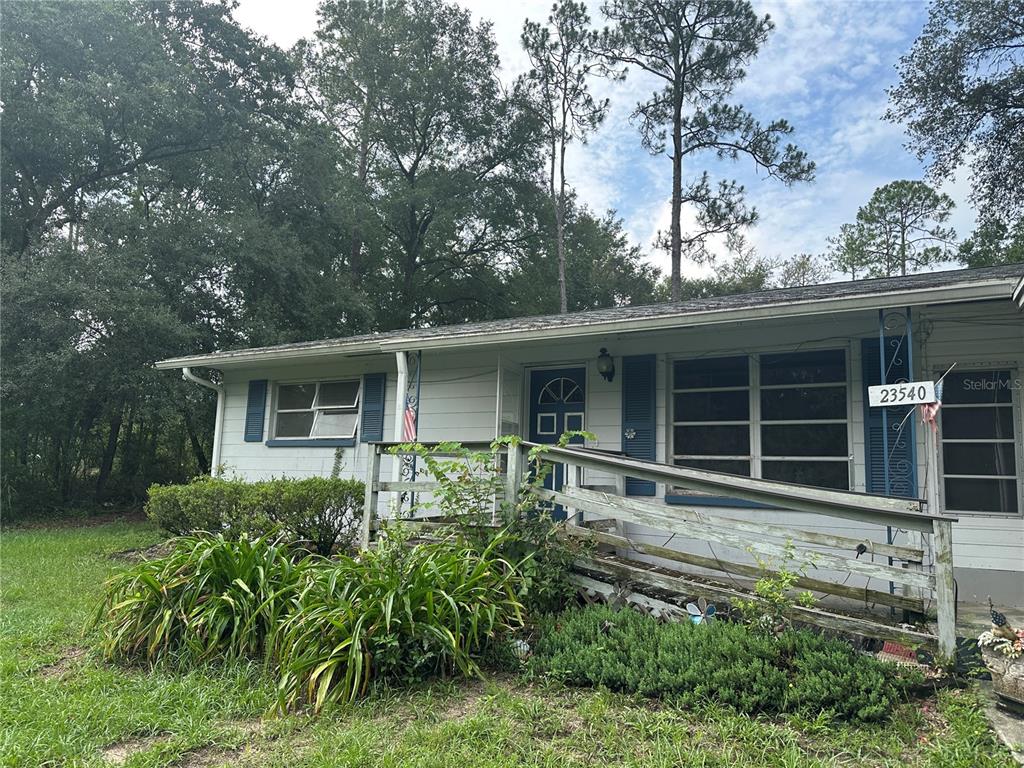 23540 Southwest Marine Boulevard Dunnellon, FL 34431 - Photo 1 of 1 front view of house with a yard