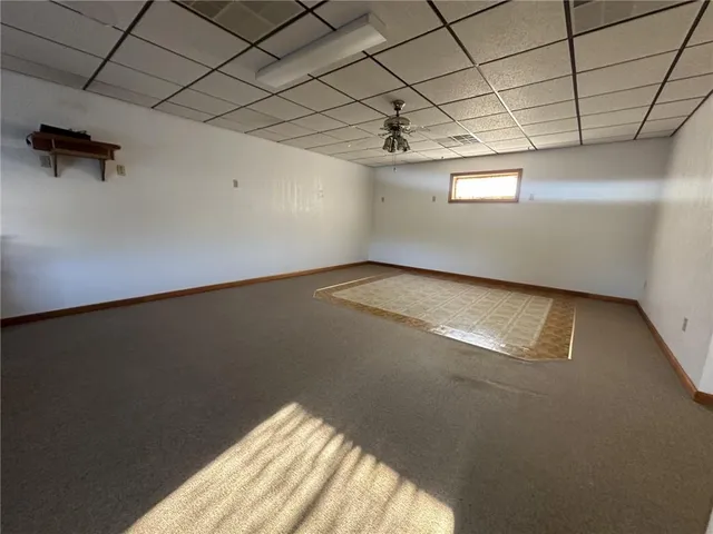 a view of a livingroom with furniture and windows
