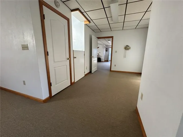 a view of a livingroom with furniture and windows