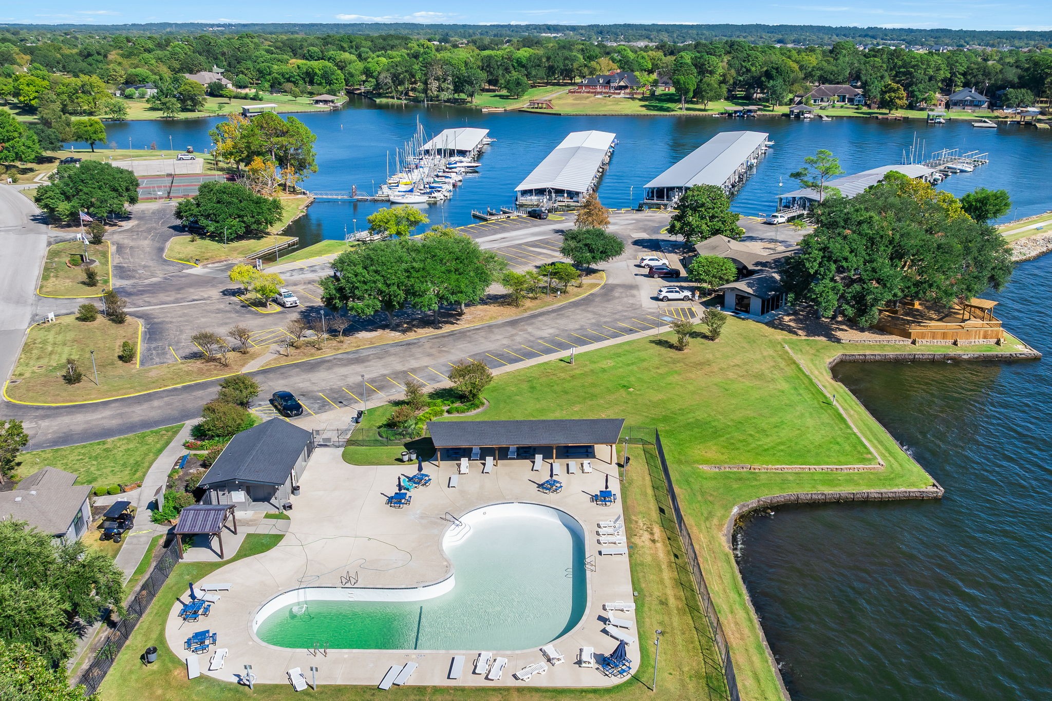 6971 Breezy Point Willis, TX 77318 - Photo 46 of 49 Community pool and marina/ boat launch area.