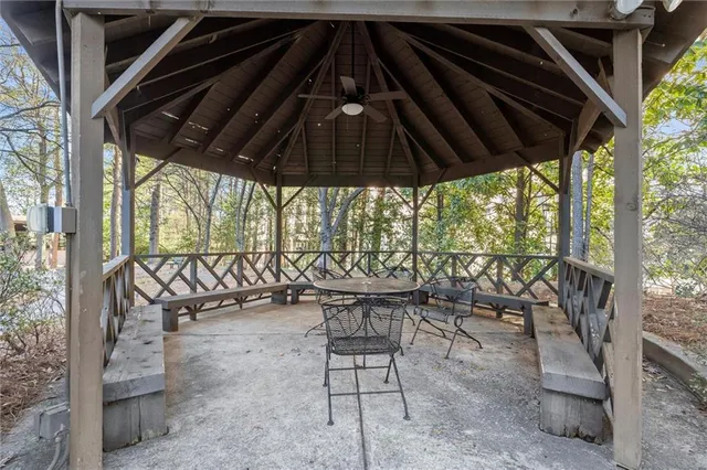 a patio with a table and chairs
