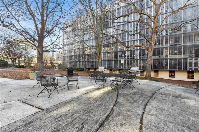 a view of a patio with a table and chairs