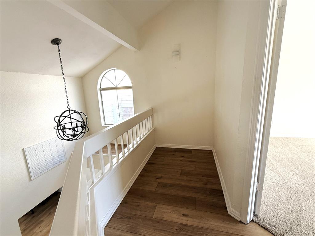 4243 Timberglen Road Dallas, TX 75287 - Photo 12 of 16 a view of entryway with wooden floor