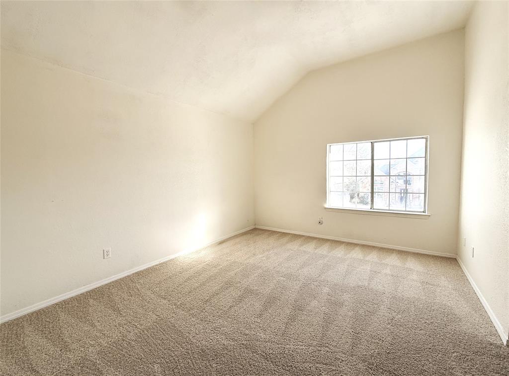 4243 Timberglen Road Dallas, TX 75287 - Photo 13 of 16 an empty room with a window