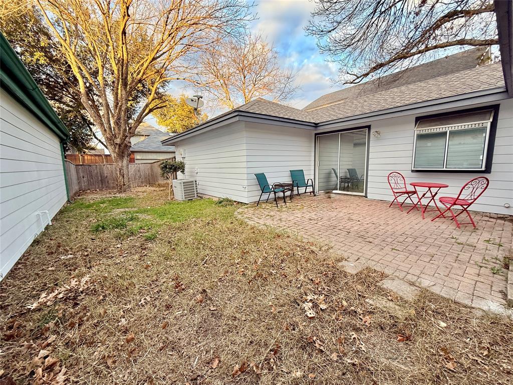 4243 Timberglen Road Dallas, TX 75287 - Photo 7 of 16 a backyard of a house with table and chairs
