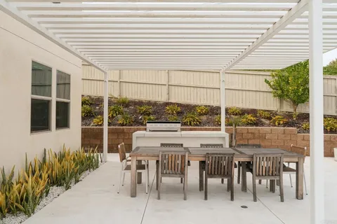 a outdoor dining space with furniture
