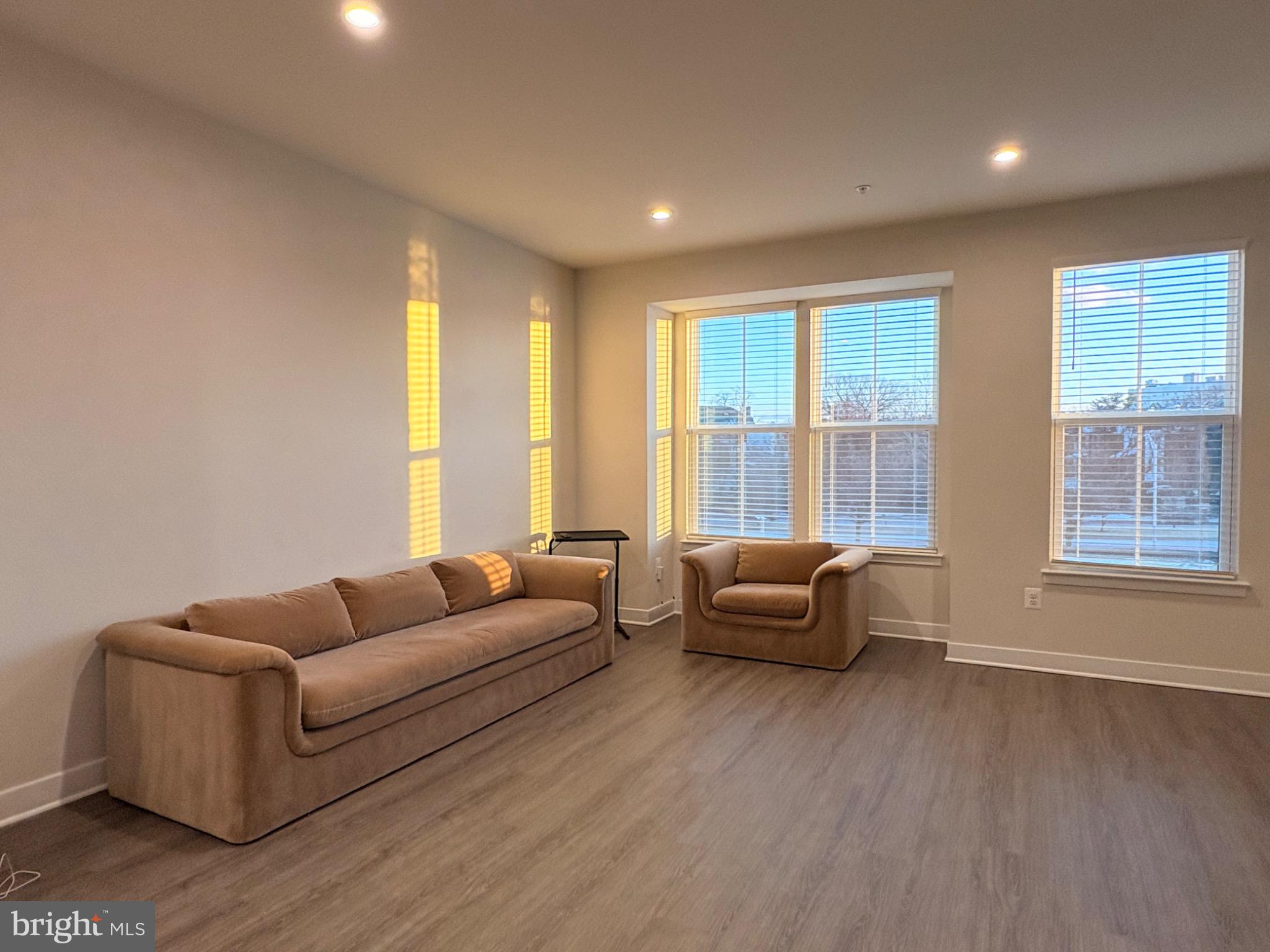 736 Watts Street Baltimore, MD 21217 - Photo 11 of 32 a living room with furniture and a large window