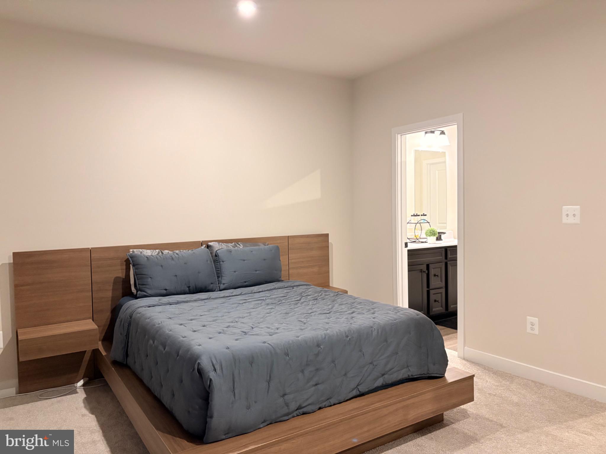 736 Watts Street Baltimore, MD 21217 - Photo 16 of 32 a bedroom with a bed and a night stand