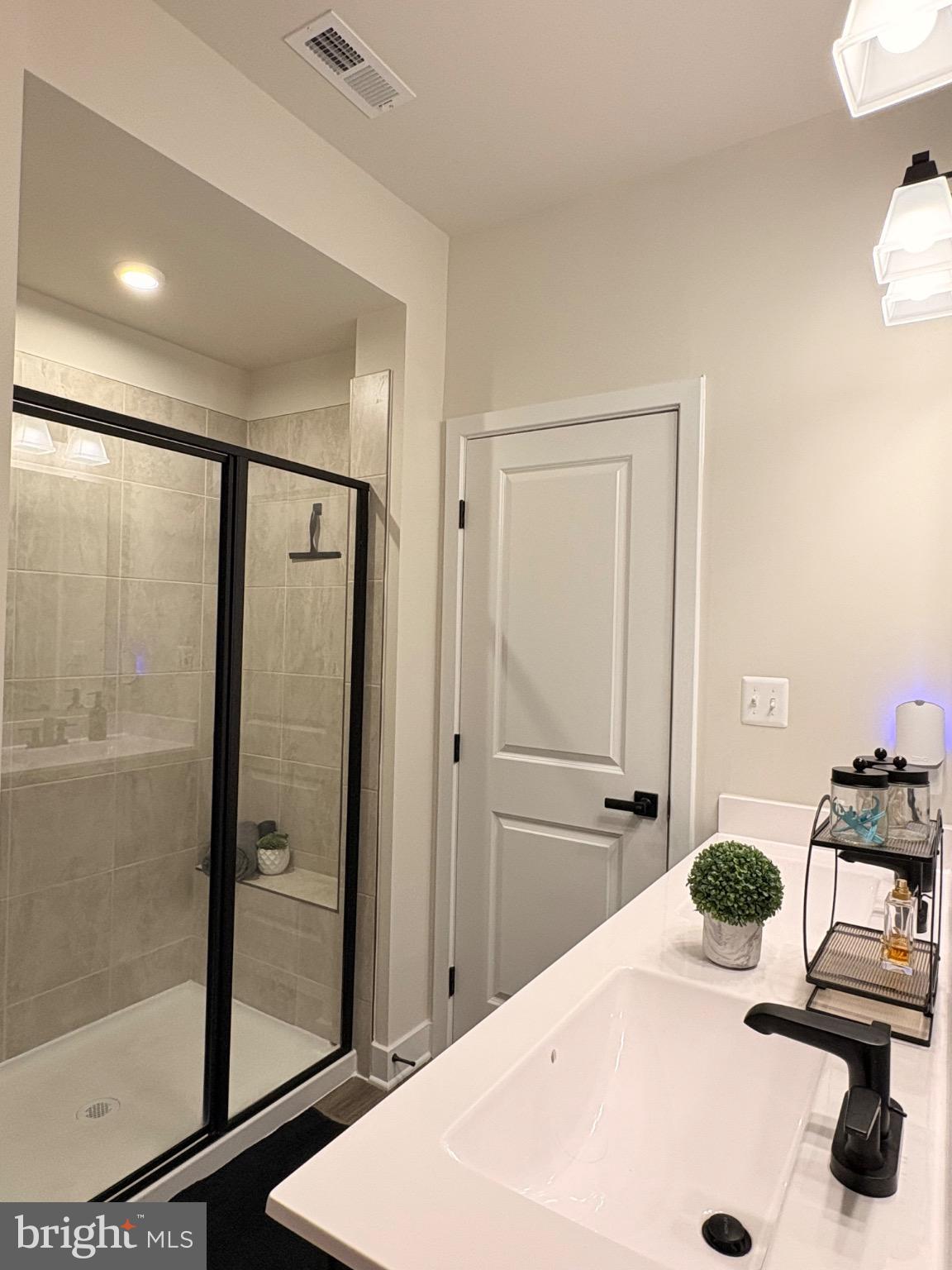 736 Watts Street Baltimore, MD 21217 - Photo 19 of 32 a bathroom with a sink and a mirror